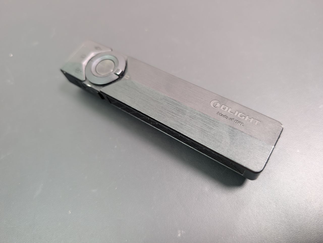 Olight ArkPro Ultra flat EDC flashlight, front view