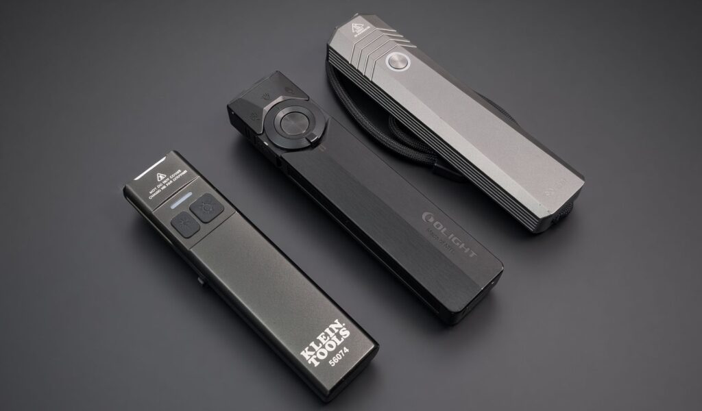 Klein 56074, Olight ArkPro Ultra, and Sofirn ST1 flat EDC flashlights side by side