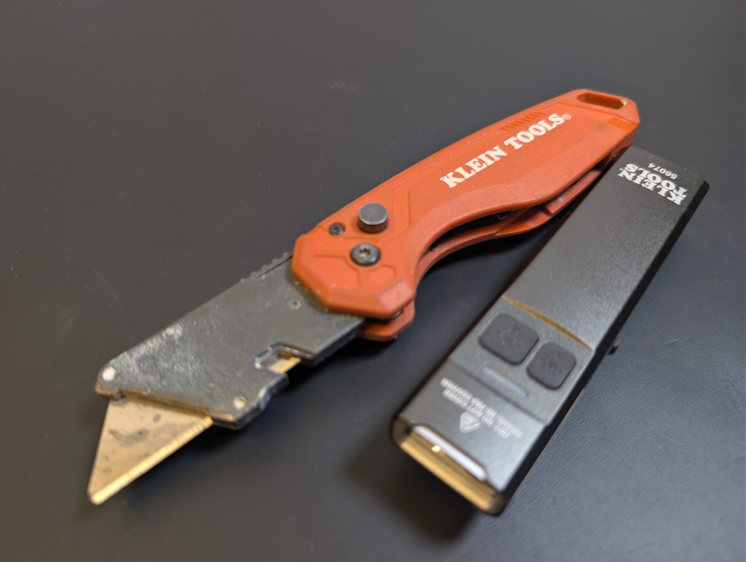 Klein folding utility knife and compact Klein flashlight