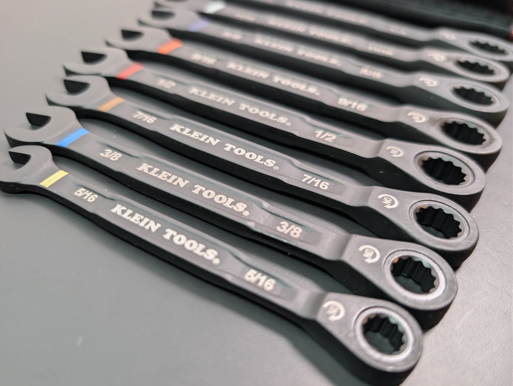 Close-up of the Klein 69408G SAE wrenches showing size stamps and 12-point box ends